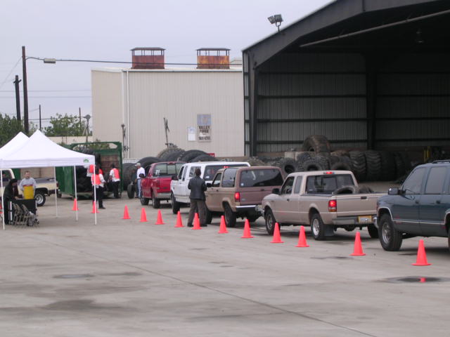 line of vehicles arrive at event