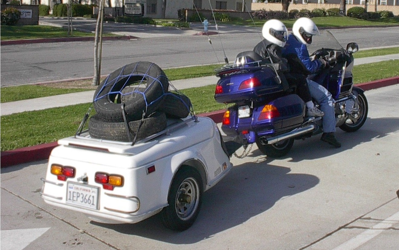 a resident drops by on motorcycle